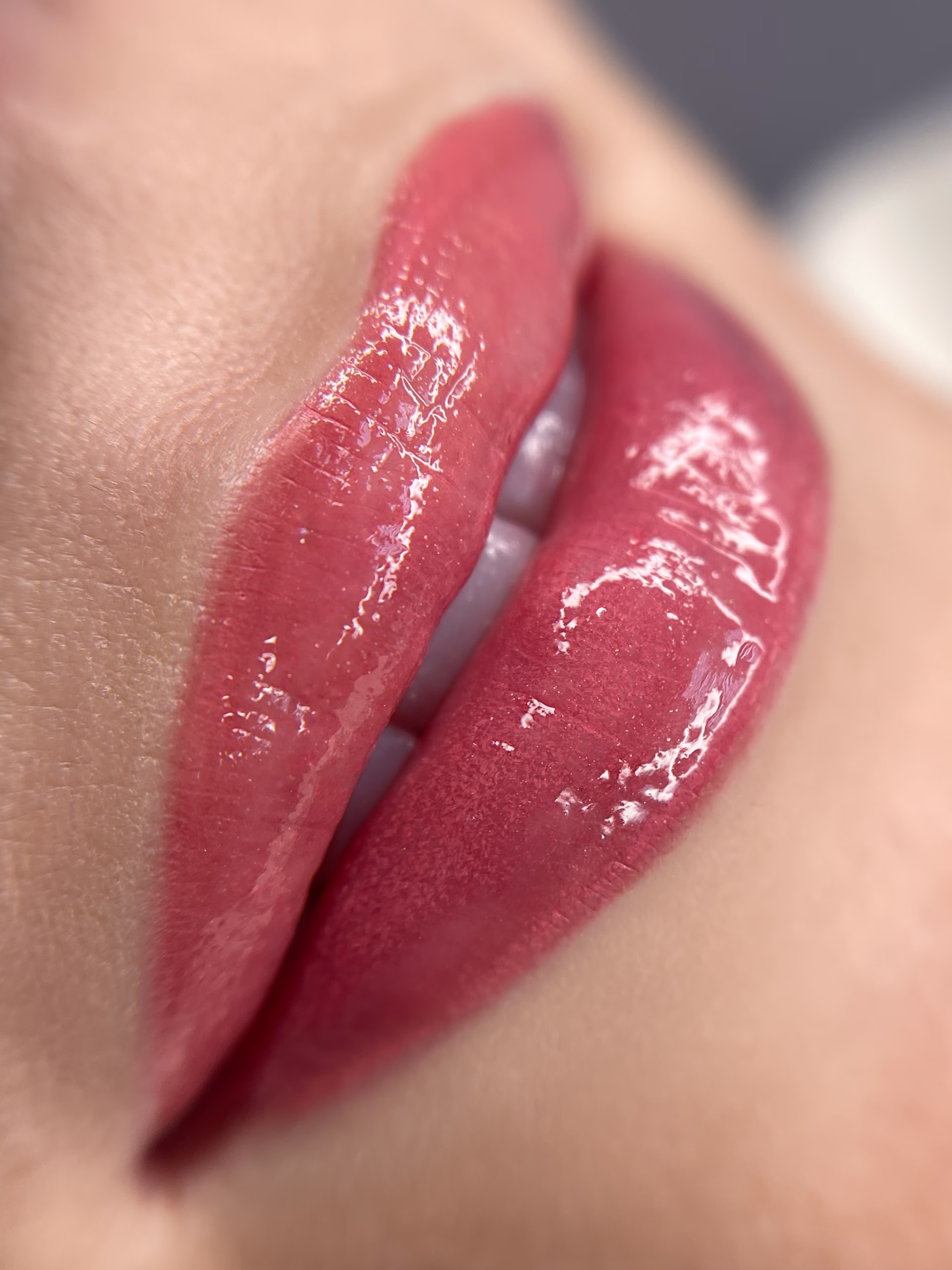 permanent sexy womans lips tattoo close up, lipstick effect make up, the lips after a tattoo with a coloring pigment